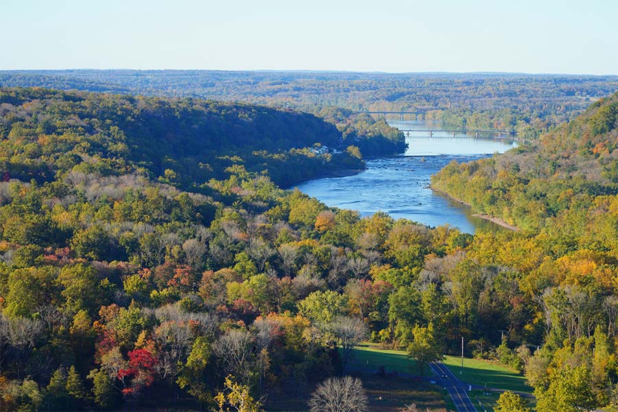 Insurance Quote - Scenic Aerial View of Green and Colorful Trees Surrounding a River in a Sunny Day in Bucks County Pennsylvania